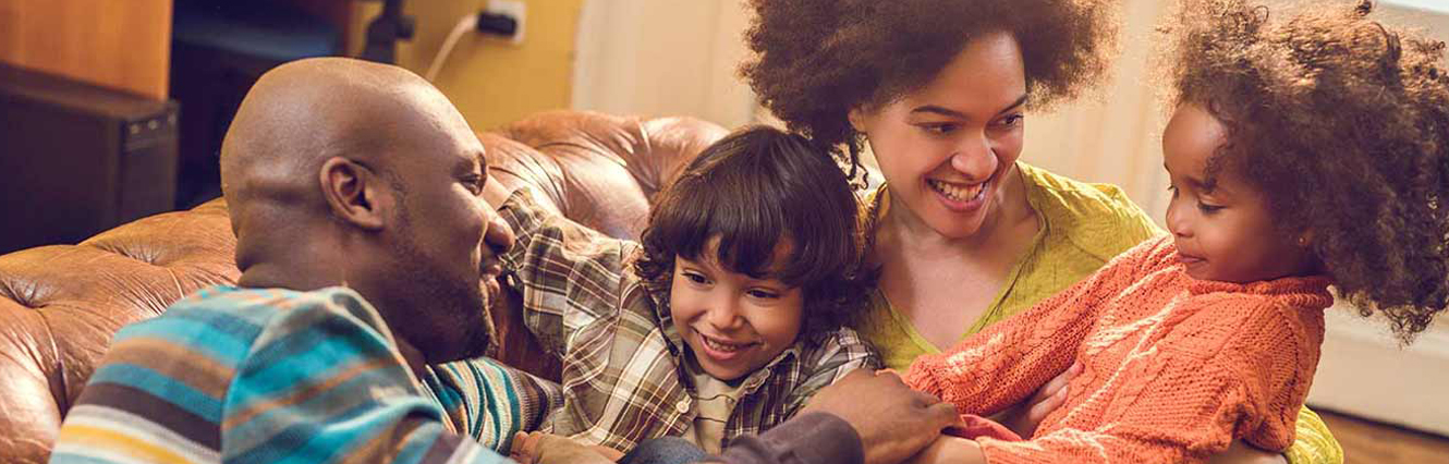 family enjoys time on the couch together